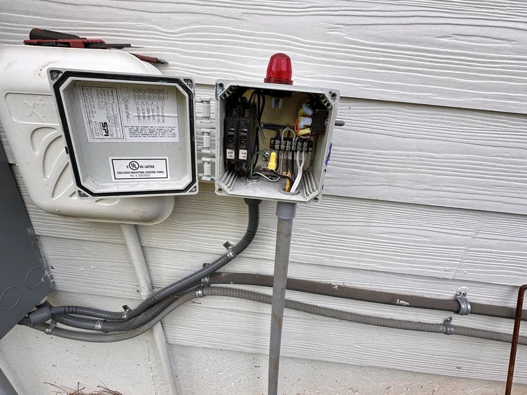 Septic pump control and alarm panel opened for service by SepticRooter™ in Chattanooga & Southeast Tennessee, Georgia
